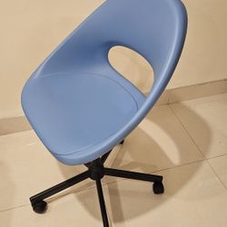 Blue IKEA Loberget swivel study chair with a ventilation cutout in the backrest.