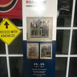 Adjustable closet organizer new in the box very very nice to put all your summer clothes away and break out the winter stuff