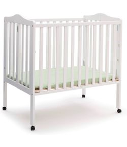 Mini crib and mattress