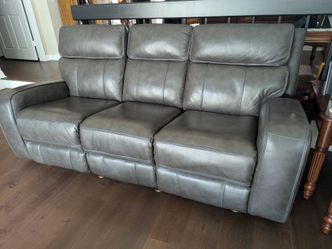 Power leather reclining sofa and loveseat