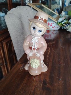 Vintage 80s ceramic Pilgrim boy we ith bag of fruit