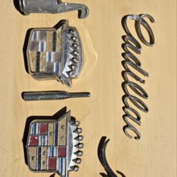 Cadillac hubcaps,and Cadillac emblems and ornaments,