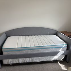 Grey Upholstered Day Bed With Pop Up Trundle And Two Mattresses
