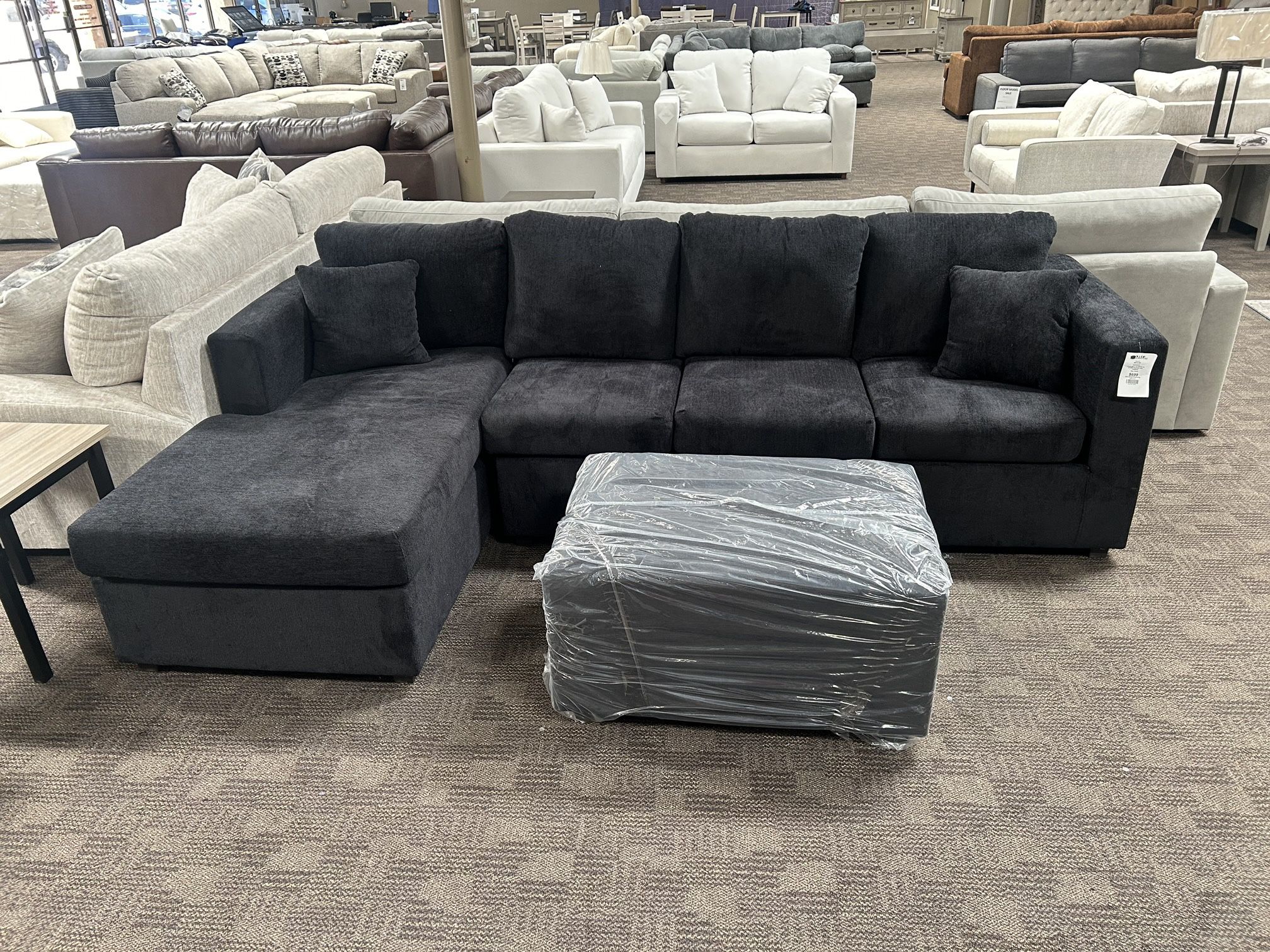 Black Sectional And Ottoman 