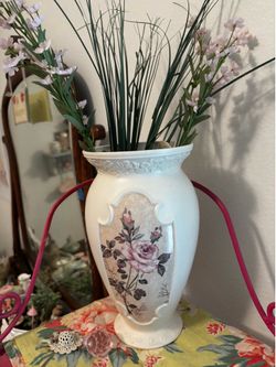 Cream metal vase with lavender and pink flowers