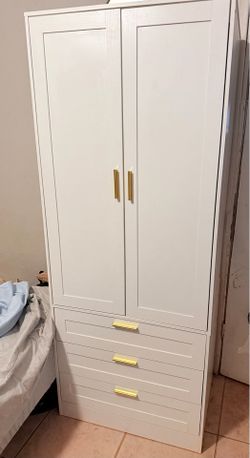 White wardrobe closet with drawers