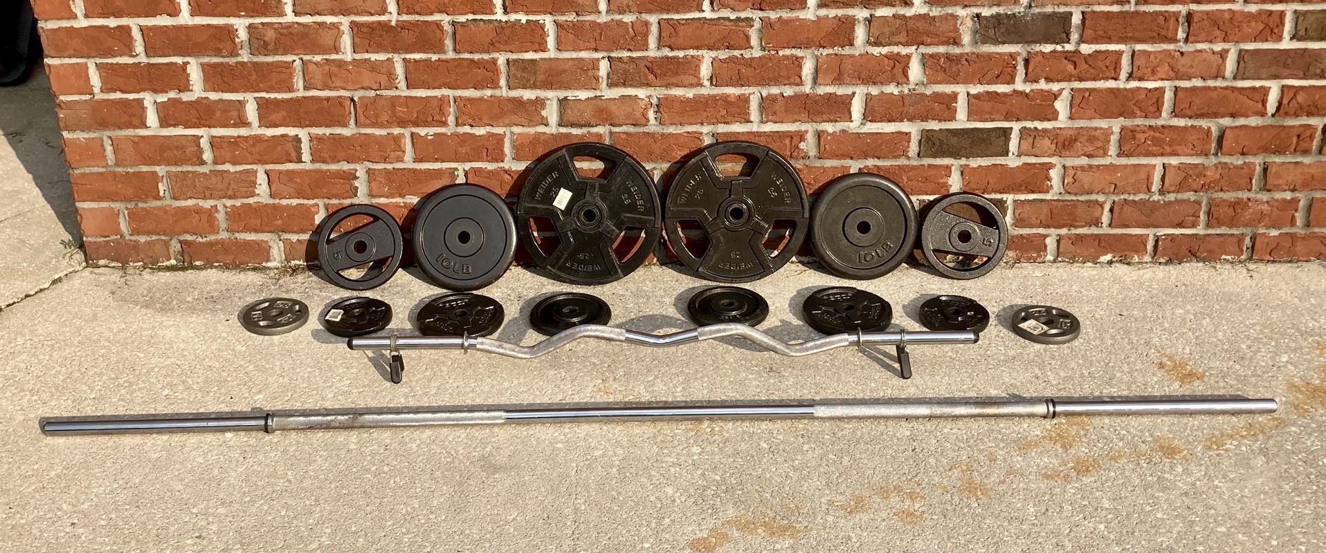 Set of Standard Barbell Weights & Curl Bar w/ Clips 14 Plates Total = 134 Pounds