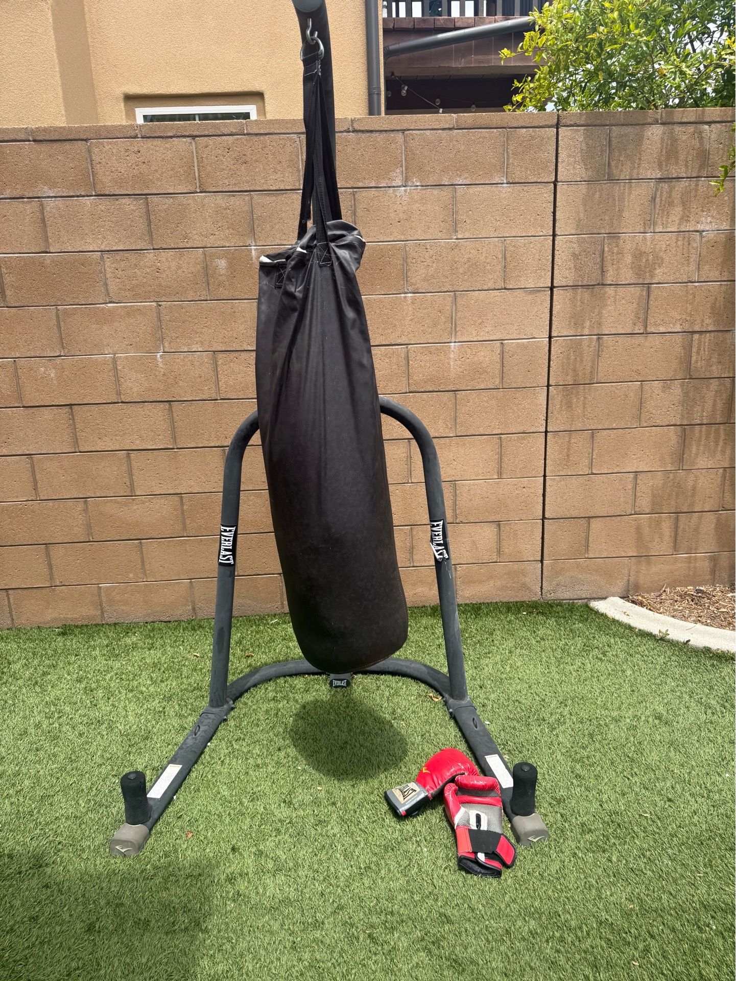 Punching bag with stand and gloves