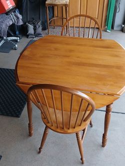 Antique table with two chairs