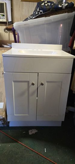 24" white porcelain sink with 2 door cabinet vanity