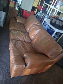 Real heavy leather sleeper sofa three cushions approximately 6 ft long