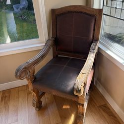 Hand carved wood and leather chair
