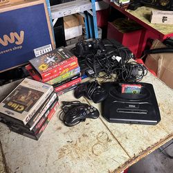 Sega genesis console with video games ps2
