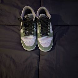 Green and white Nike low dunks