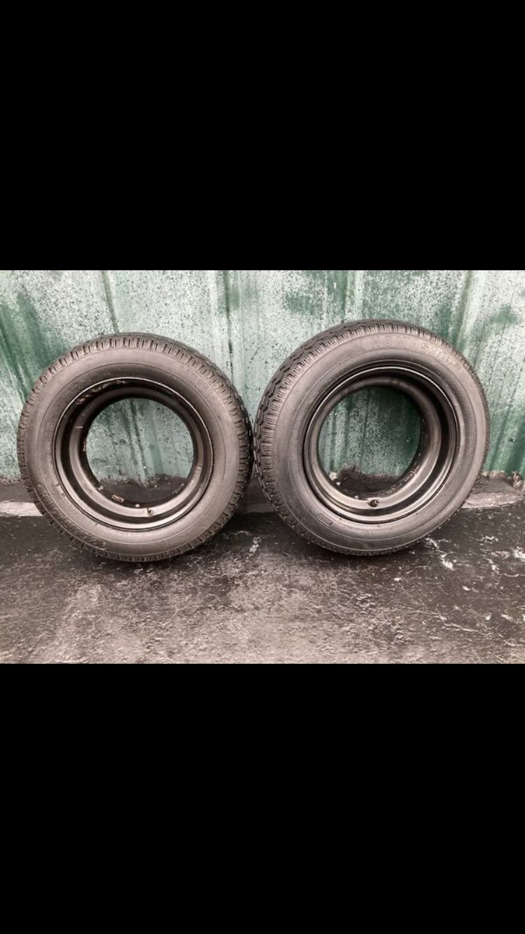 Two new tires 215/60D14.5 with rims