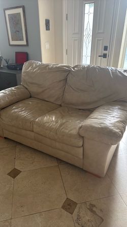 Tan leather loveseat