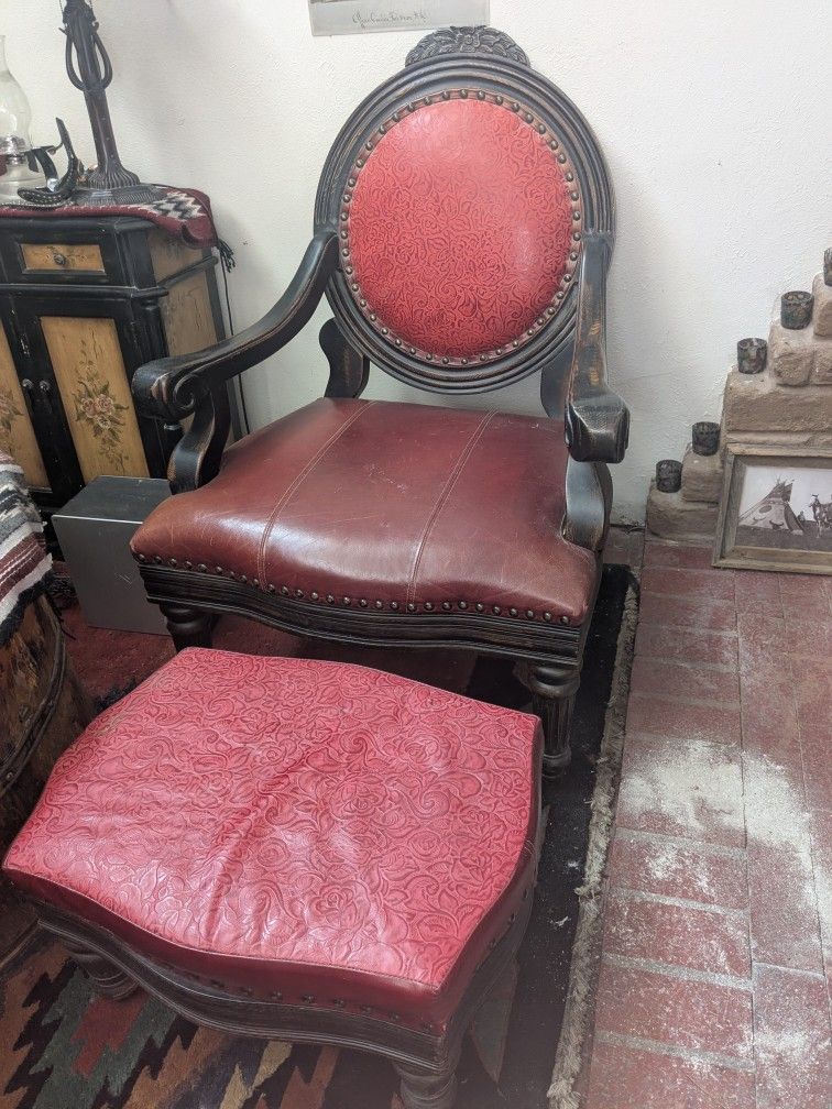 Beautiful And Oversized red With Burgundy leather studded chair wood framed feet 30 in wide. 3 ft deep 44 in high