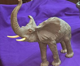 Large Detailed, Gray Elephant Sculpture With its Trunk Raised and Long Yellow-White Tusks Maybe Resin? M3D102