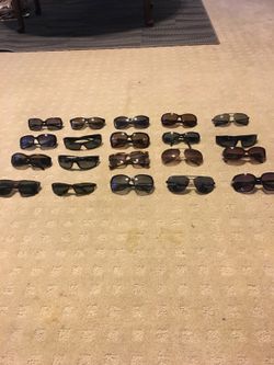 20 pair of name brand sun glasses