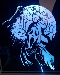 Scream etched lighted mirror