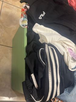 Tote full of woman’s clothes
