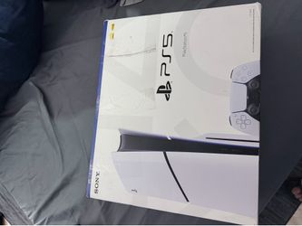 PlayStation 5 slim disc with box and controller charging stand