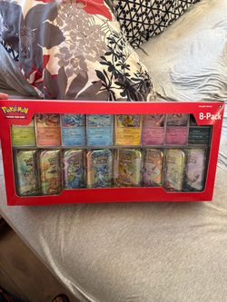 Prismatic mini Tin Set 8pk  Pokemon Tcg