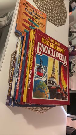 The hardcover book pictured, The Children's First Geography Encyclopedia authored by Michael W. Dempsey and published by Bookthrift in 1985, is genera