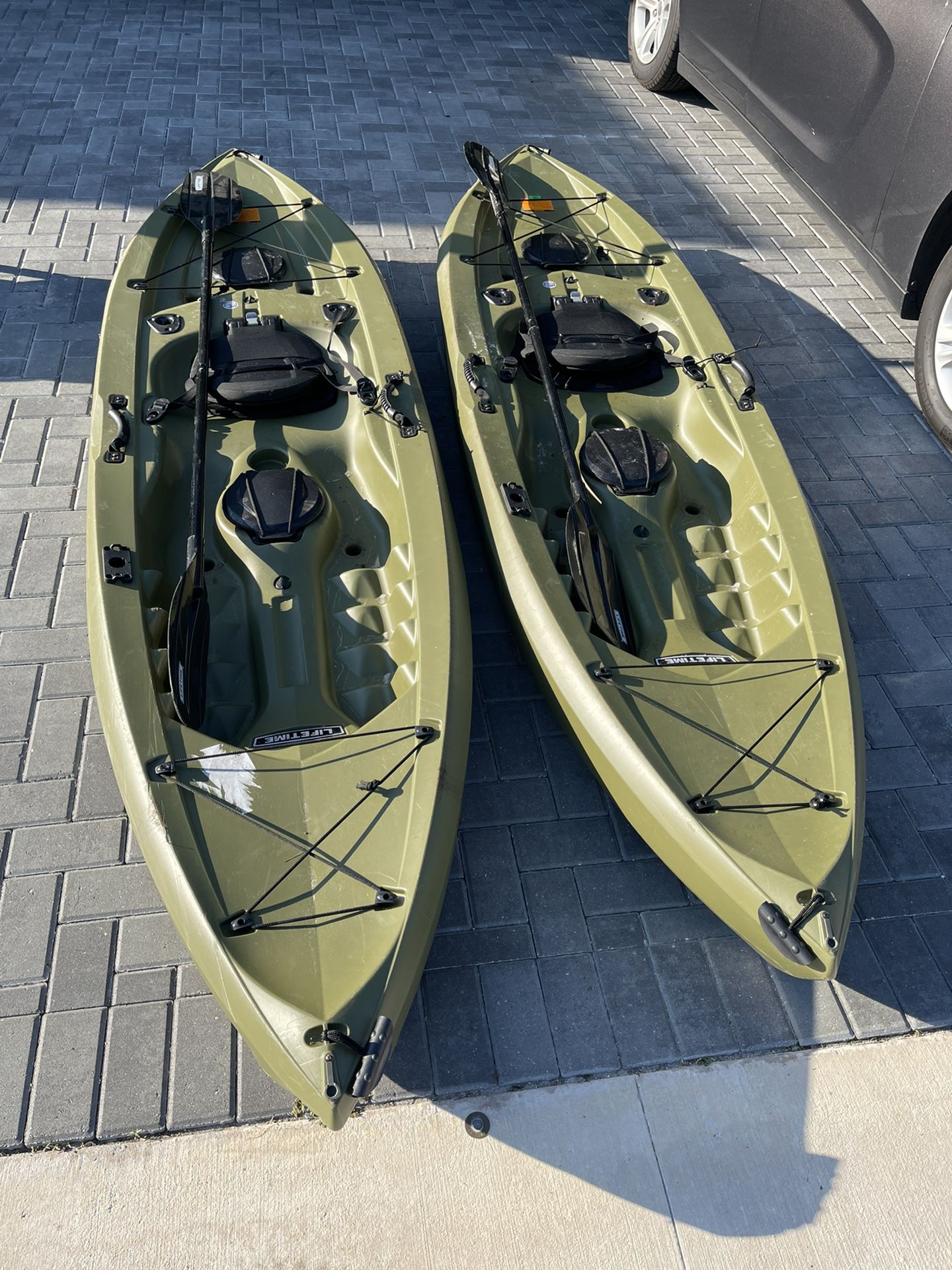 Two Lifetime Tamarack Kayaks With Paddles 
