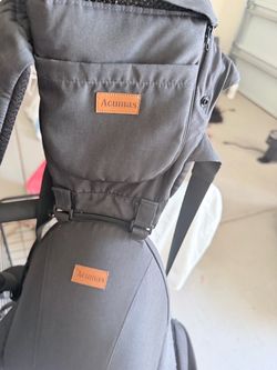 Brand new baby carrier and a high chair
