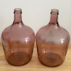 Set of two pink glass vase bottles