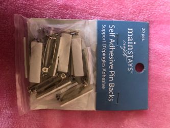 Self adhesive pin backs