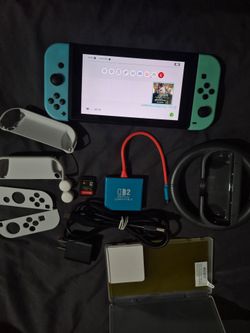 Nintendo Switch, adaptador para jugar en tv, accesorios,  y juego de supercross