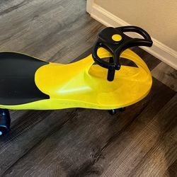 Bright yellow and black wiggle car. Fun ride-on toy for kids. Has a steering wheel. Great for indoor or outdoor play.