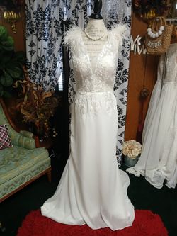 White Wedding Gown with Feathers and Lace