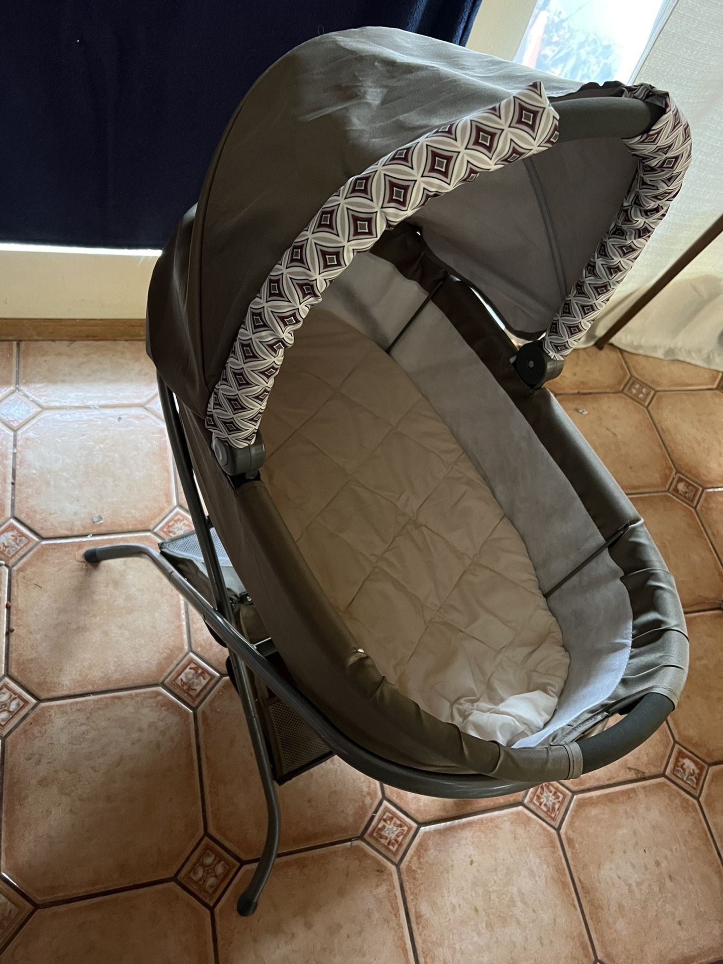 Bassinet and  baby swing