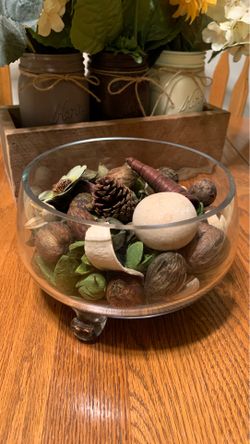 Thick glass bowl with legs 7”x5” (potpourri not included)