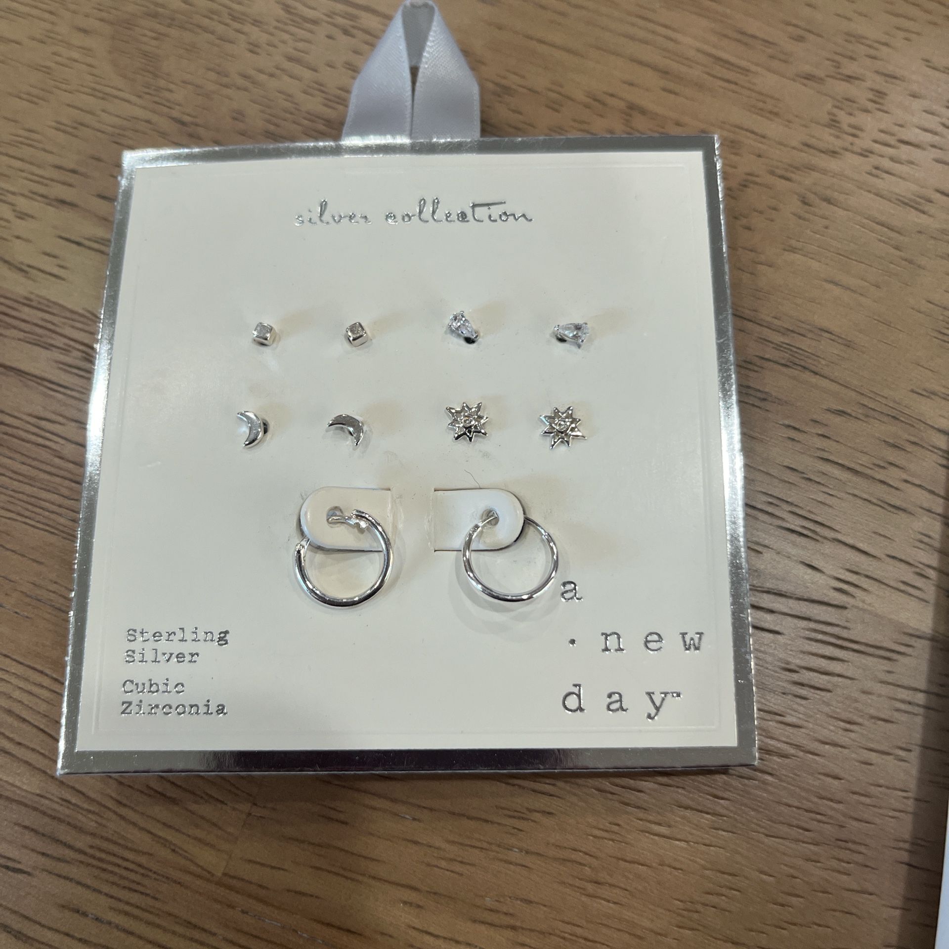 A new day sterling silver cubic zirconia set of earrings new never used