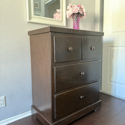 Dark brown four-drawer solid wood chest of drawers