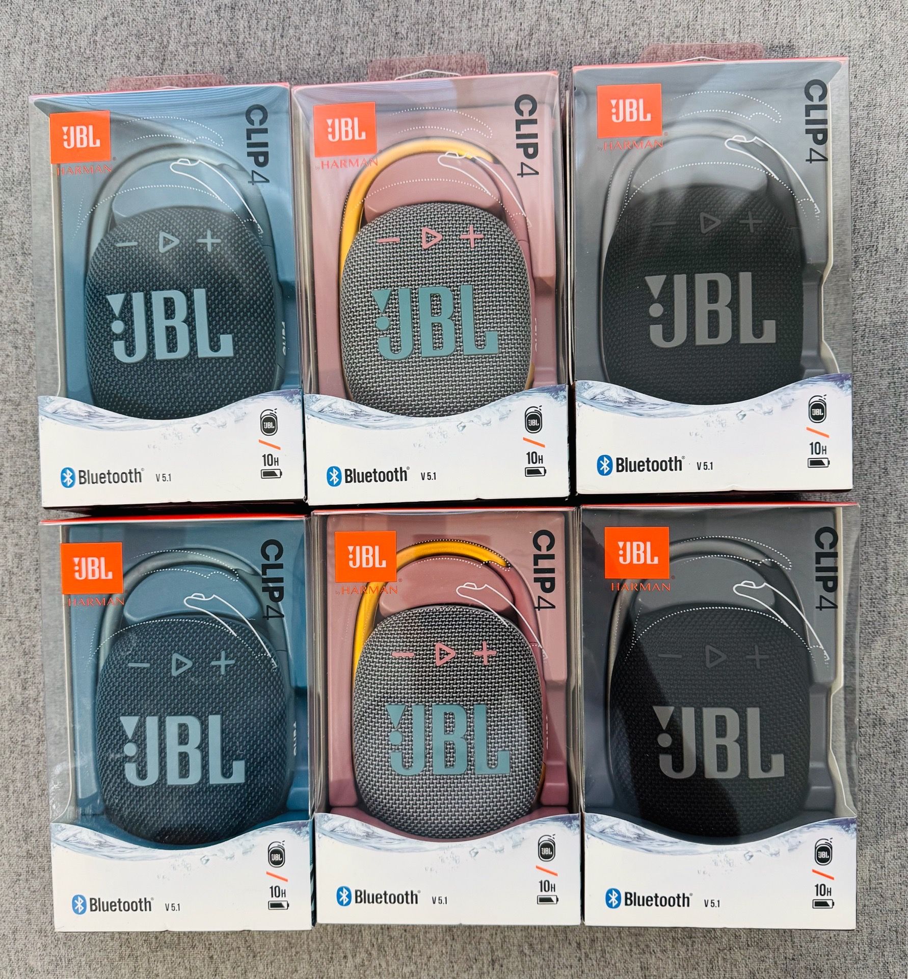 New JBL Clip 4 portable speakers come in original packaging. Each unit has a built-in carabiner for easy attachment. These speakers are waterproof and