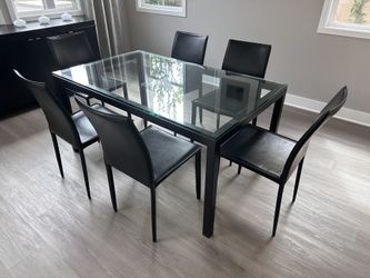 Crate&Barrel Steel Parsons Table with 1/2" thick glass with faux leather chairs