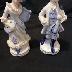 Vintage porcelain figurines get both for $12.