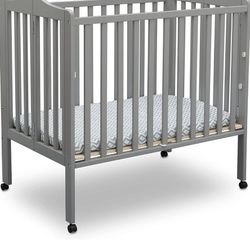 Brand New Travel Crib And Mattress And 2 Crib Sheets 