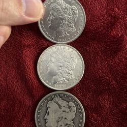3- Morgan Silver Dollars