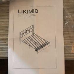 **Queen Bed Frame with Black Leather Backrest & Storage - $150**