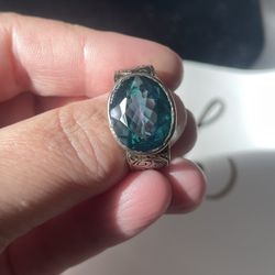 A size 9 oval, vintage style aquamarine ring on a silver band. 