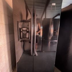Black GE Refrigerator And Freezer