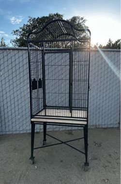 large wrought-iron style aviary/parrot cage with rolling stand