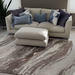 Beige Couch And Ottoman.   Priced To Sell