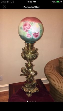 Antique brass lamp with original glass globe